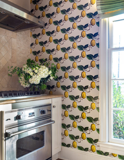 A kitchen with a stove and a window